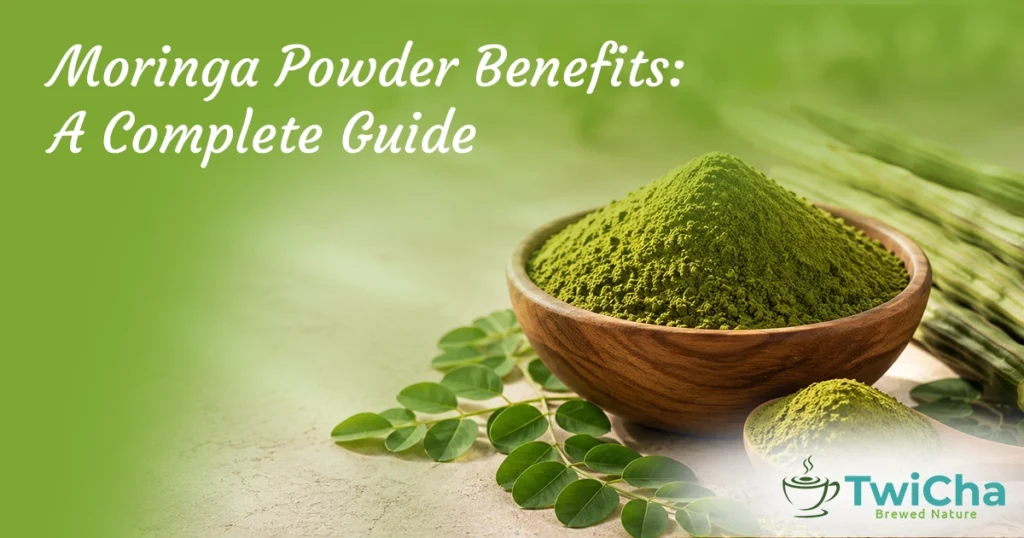 Fresh moringa powder in a wooden bowl with Moringa oleifera leaves and drumstick pods, highlighting the nutritional benefits of moringa powder for daily wellness.